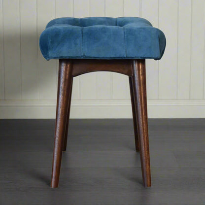 Full side view of the mini teal velvet curve bench, showing its curved design and walnut finish legs.