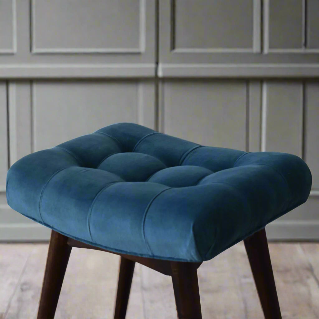 Top-down view of the mini teal velvet curve bench seat, showcasing the complete deep button pattern on top and a section of its feet.