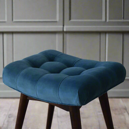 Top-down view of the mini teal velvet curve bench seat, showcasing the complete deep button pattern on top and a section of its feet.