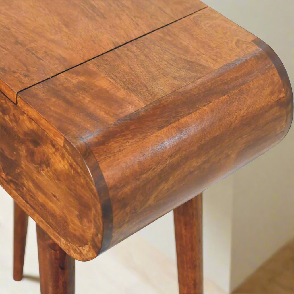 Close‑up of rounded left edge showing chestnut craftsmanship