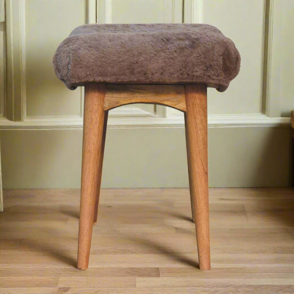 Full side view of the Mocha Faux Fur Curve Stool, displaying its elegant curved silhouette.