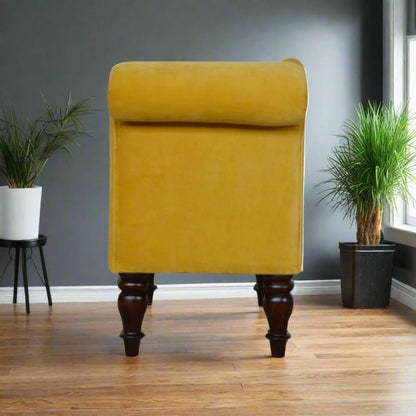 Full side view of the mustard velvet chaise, displaying its elegant profile and design.