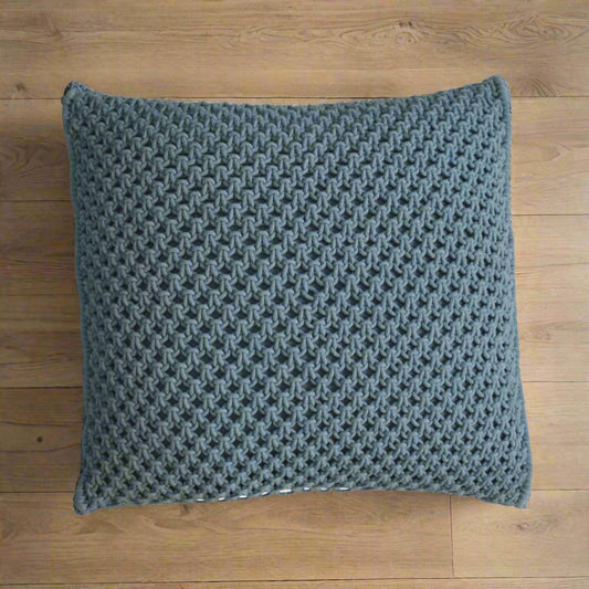 Aerial view of a single Myra blue cushion, highlighting its intricate woven design and texture.