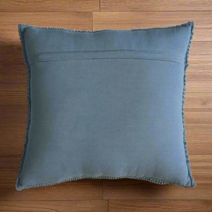 Aerial shot focusing on the underside of one Myra blue cushion, showcasing the modern blue material used.