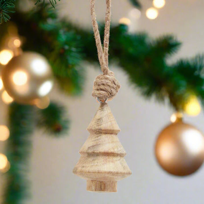 A natural hand-turned wooden Christmas tree bauble with a rustic rope hanger, showcasing unique wood grain and a classic tree shape, perfect for festive decor.