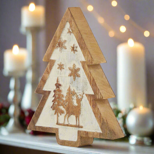 A rustic natural wooden snow scene tree decoration featuring a layered design with carved reindeer and snowy trees, perfect for a winter forest display.