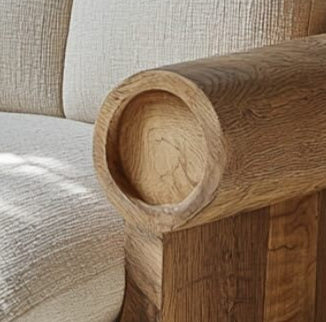 A zoom in to the masterclass finish of the cylindrical armrest of the Oakridge Boucle Chair