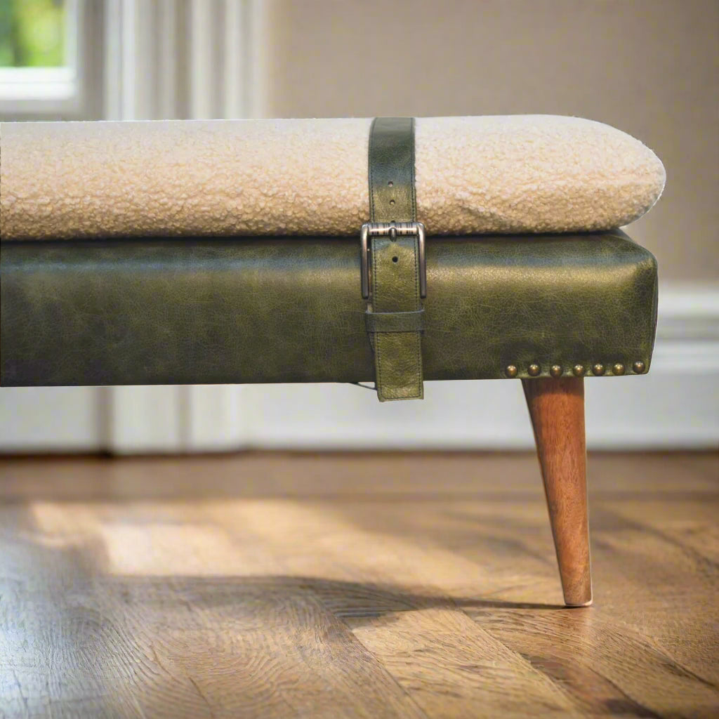 Closer zoomed view of the left edge of the Olive Green Leather Boucle Bench, showing the strapped-on boucle cushion.