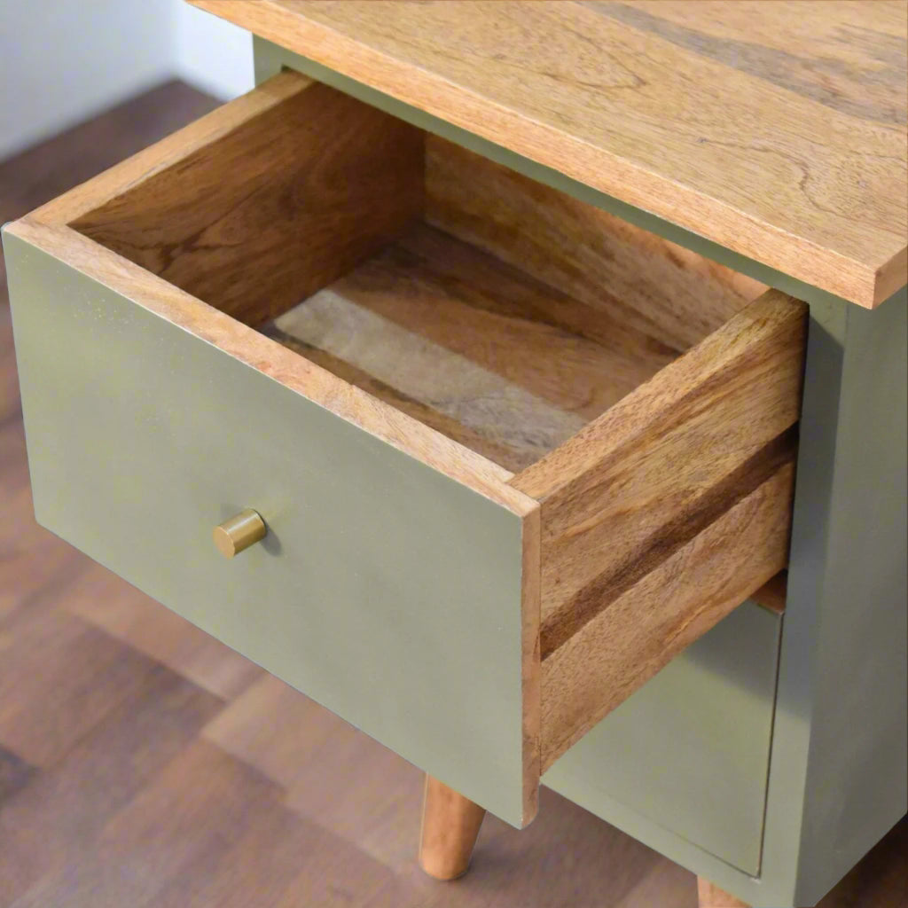 Top-down view of the olive hand-painted bedside table with the top drawer pulled open, revealing the interior storage and the wooden top surface.