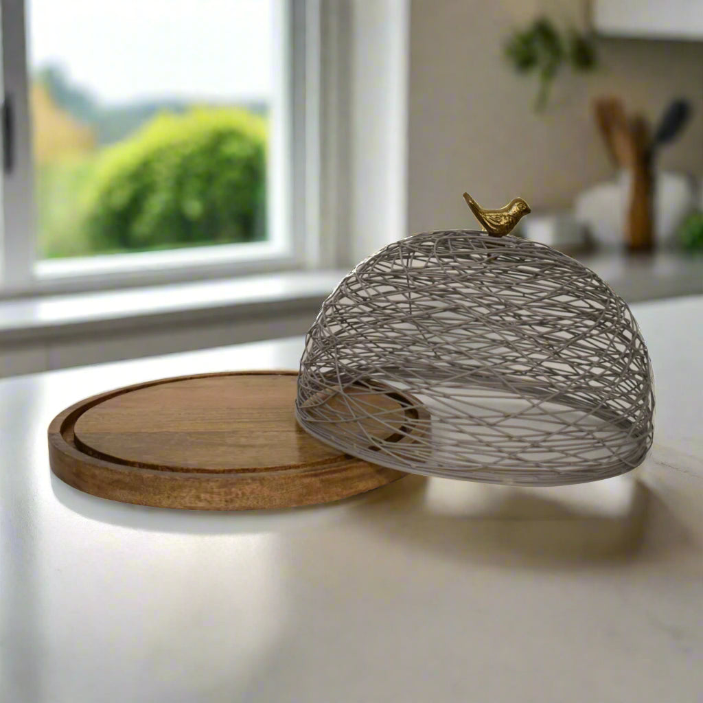 Wide view of the Blue Bird Nest Cake Stand with the netted top slightly tilted, revealing interior display space