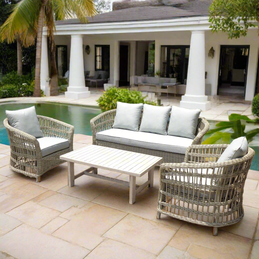 Palma 5 seater outdoor sofa set with grey wicker weave, plush cushions, and matching acacia wood coffee table, displayed on a patio.