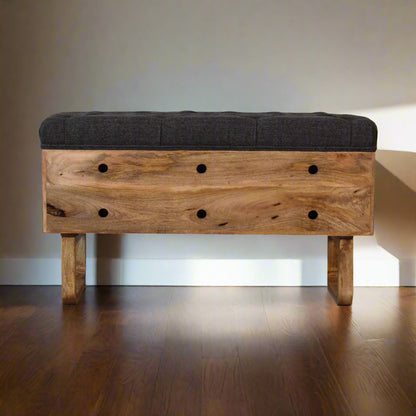 Pineapple carved storage bench placed against a wall.