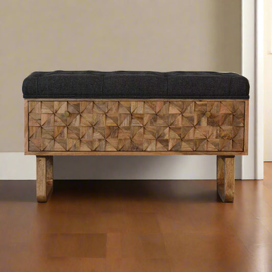 Front view of solid mango wood storage bench with grey tweed upholstered seat and hand-carved pineapple door front.