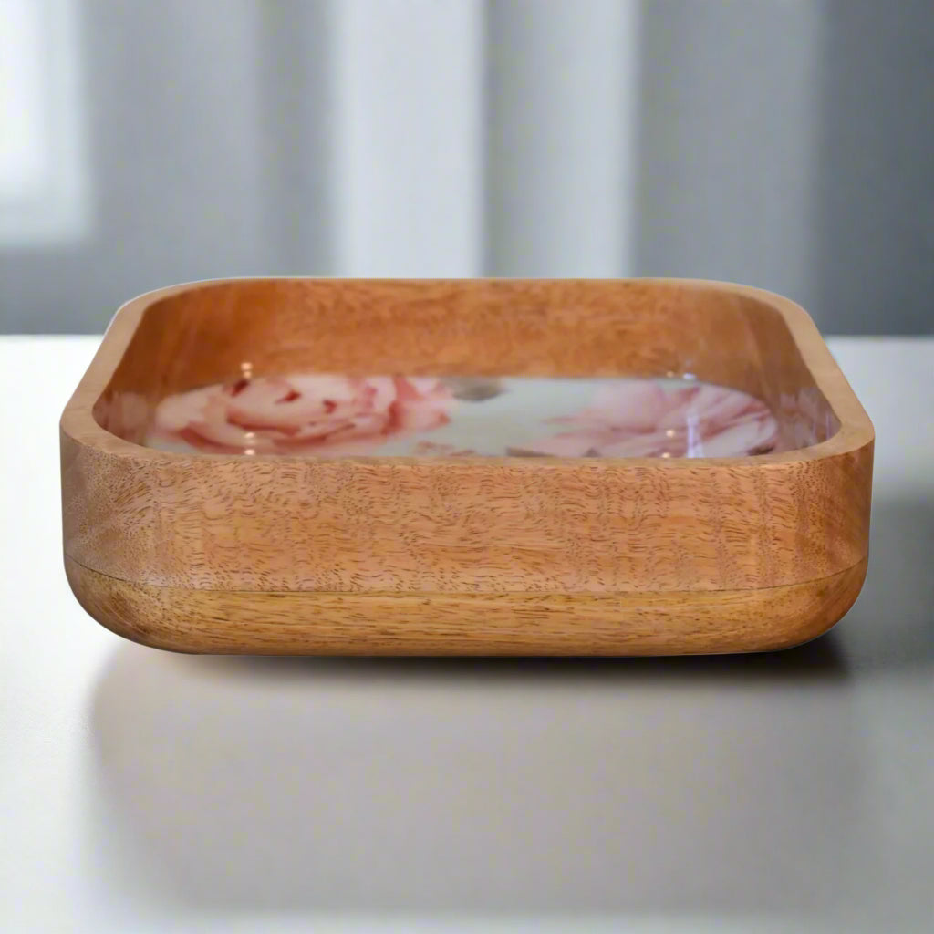 Eye level view of the Pink Floral Square Bowl, highlighting the natural wooden grain on the outside and the smooth rim of the bowl.