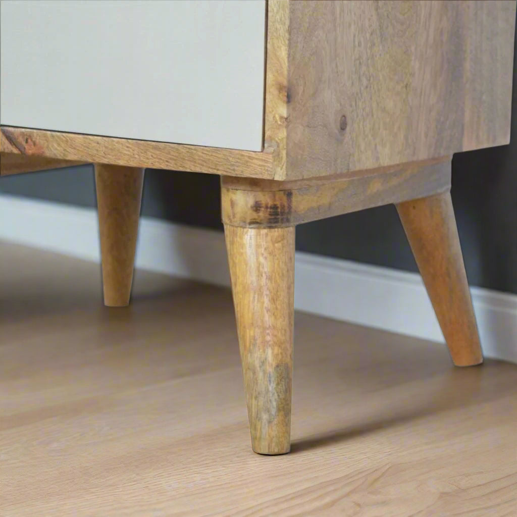 Close-up view of the Nordic style legs on the Pink Gradient Cut-Out 3 Drawer Bedside Table.