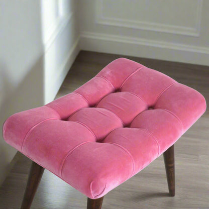 Elevated view of the Pink Velvet Curve Stool, specifically focusing on the intricate deep button pattern of its velvet upholstered seat.
