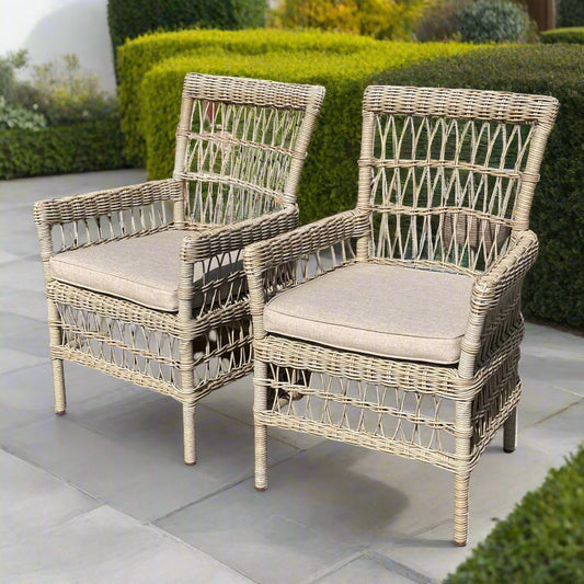 Close-up of two chairs from the Provence 6 Seater Dining Set, showing the wicker weave and cushions.