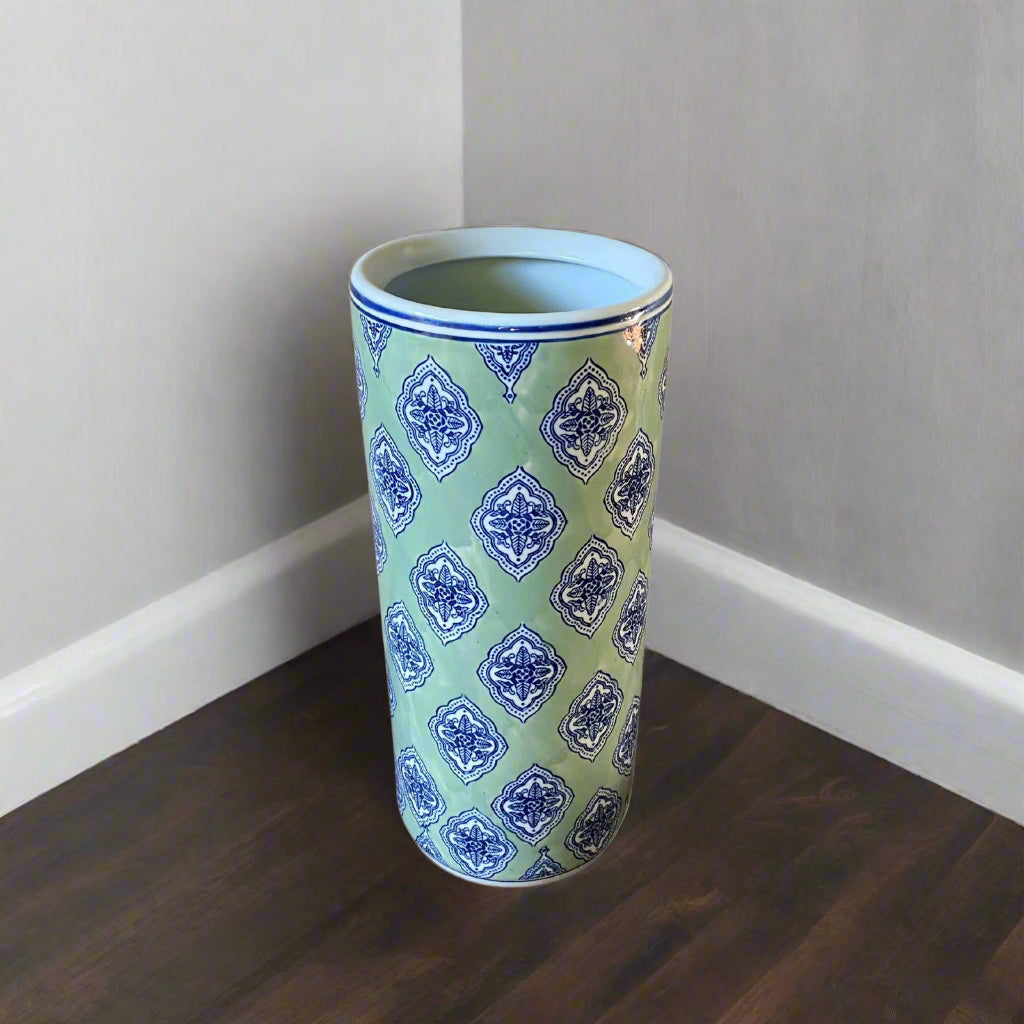 Purple Flamingo tall green and blue diamond print ceramic umbrella or stick stand with a glossy finish, shown in a room.