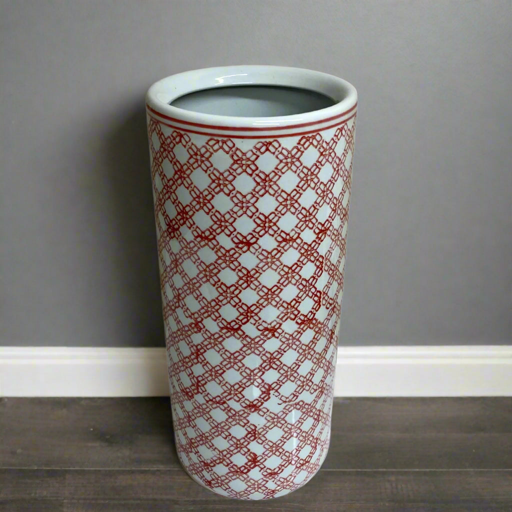 Purple Flamingo tall red and white daisy chain ceramic umbrella or stick stand with a glossy finish, shown in a room.