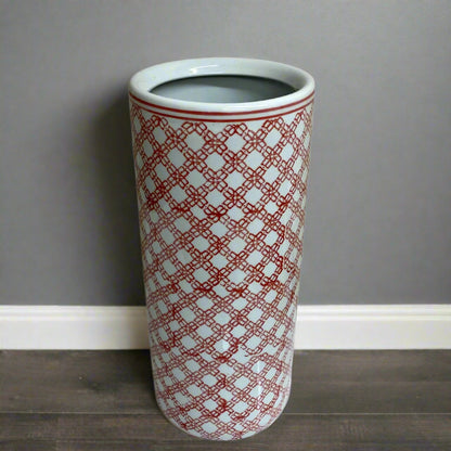 Purple Flamingo tall red and white daisy chain ceramic umbrella or stick stand with a glossy finish, shown in a room.