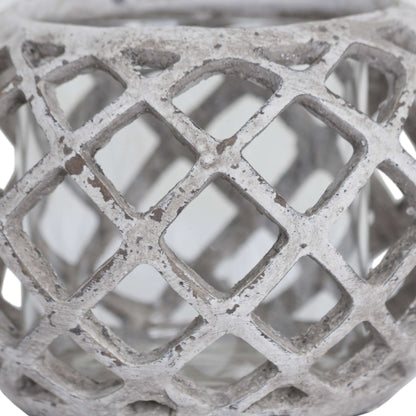 Close-up of the ceramic lantern showing detailed lattice design and neutral stone tone.