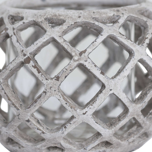 Close-up of the ceramic lantern showing detailed lattice design and neutral stone tone.