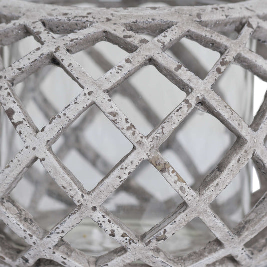 Zoomed-in view of the lattice pattern and soft stone finish of the round lantern.
