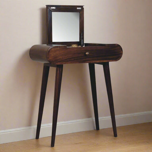 Rounded mini dressing table with california walnut finish, displaying fold-up mirror open and nordic style legs.