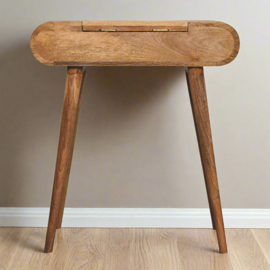 Back view of the rounded mini dressing table, with oak-ish finish, highlighting the discreet fold-up mirror hinges