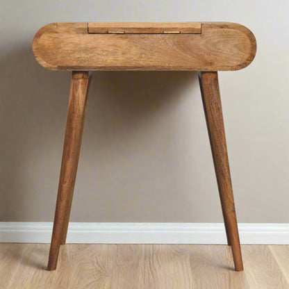 Back view of the rounded mini dressing table, with oak-ish finish, highlighting the discreet fold-up mirror hinges