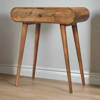 Front angled view of the rounded mini dressing table, with oak-ish finish