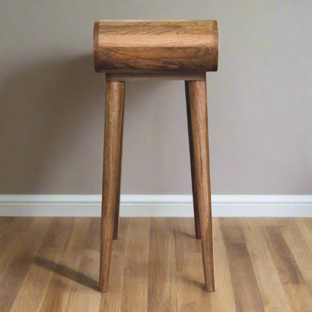 Side view of the rounded mini dressing table, with oak-ish finish, displaying the smooth rounded table top outline
