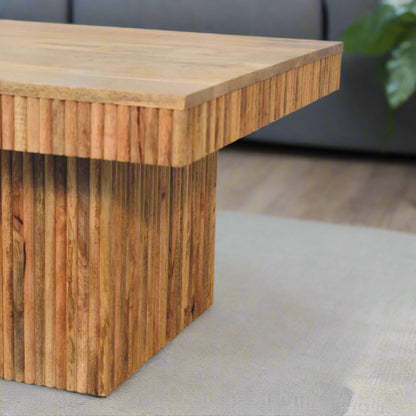 ngled view focusing on the thick ridged base and a section of the Soba Chunky Coffee Table, emphasizing its unique design feature.