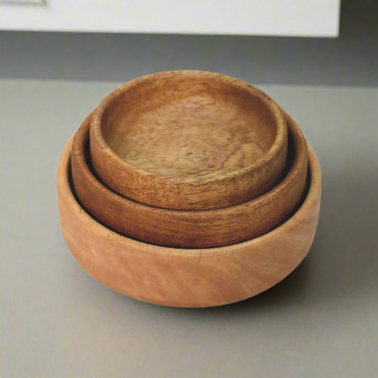 Top-down view of stacked bowls highlighting natural finish and round shape.