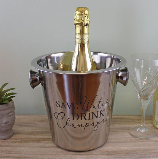 Stainless steel champagne bucket with handles holding a champagne bottle
