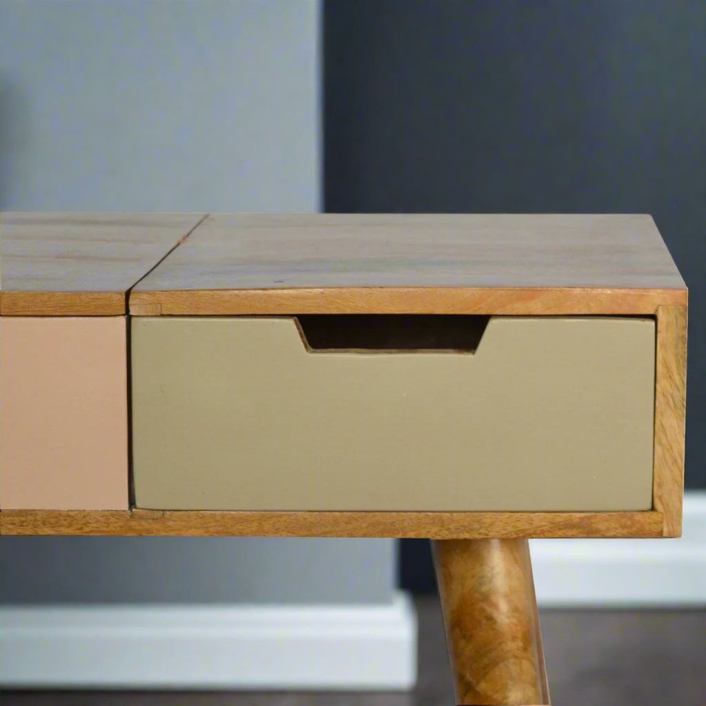 Close-up of hand-painted pink gradient drawer with integrated cut-out handle on standard straight edge dressing table in oak finish