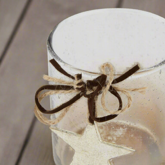 Birds eye view of coffee ombre candle holder, displaying the decorative star and twine and velvet ribbon. Shop at Purple Flamingo UK.