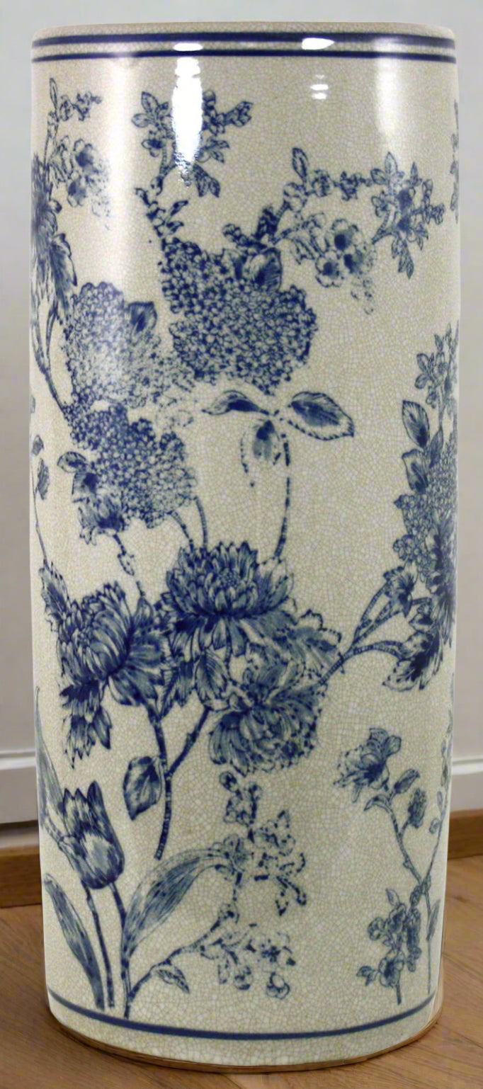 Vintage style ceramic umbrella stand with blue and white magnolia floral pattern and distressed finish for hallway storage