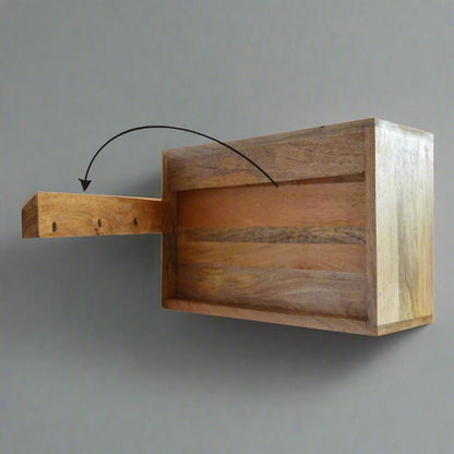 Instructional back view of the wall mounted leopard print drawer table, illustrating how it mounts to the wall with an arrow indicating drawer movement.