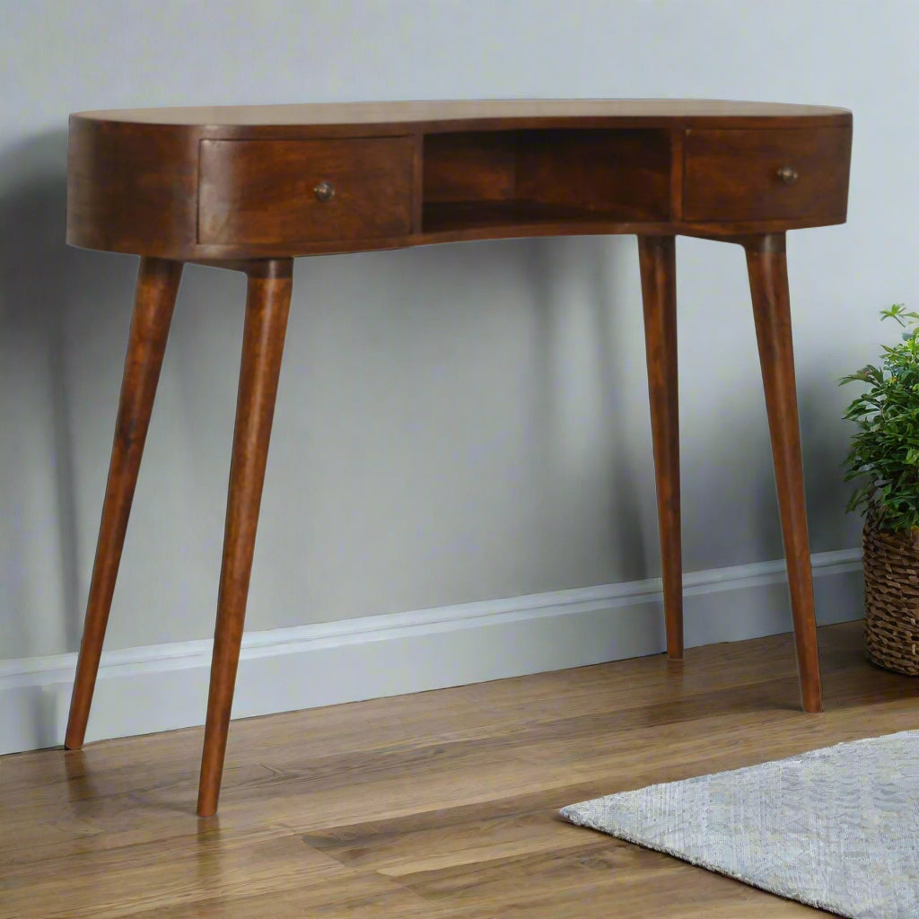 Front angled view of the Wave Desk with Drawers, showcasing its unique shaped design, chestnut finish, and Nordic style legs.