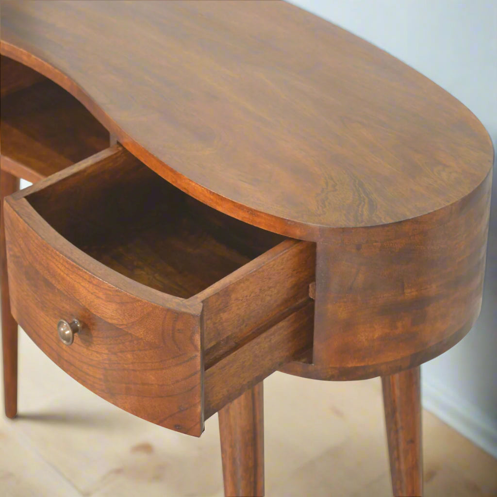 Elevated view from the left side of the Wave Desk with the left mini drawer pulled out, revealing interior storage space.