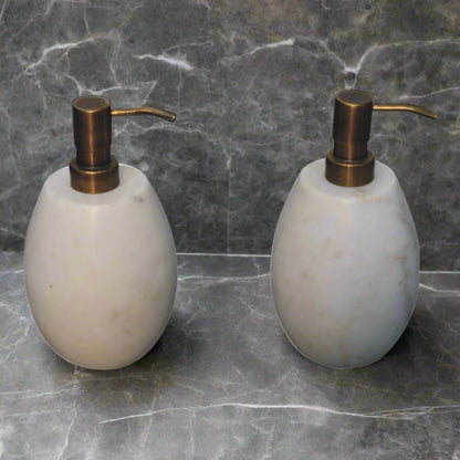 Elevated shot of both white marble dispensers.