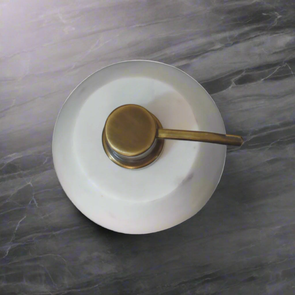 Aerial shot of one white marble dispenser, highlighting its sleek design and size.