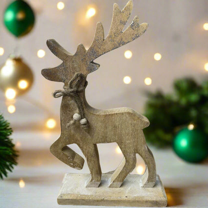wooden reindeer with glittery antlers and twine neck tie placed in a festive setting