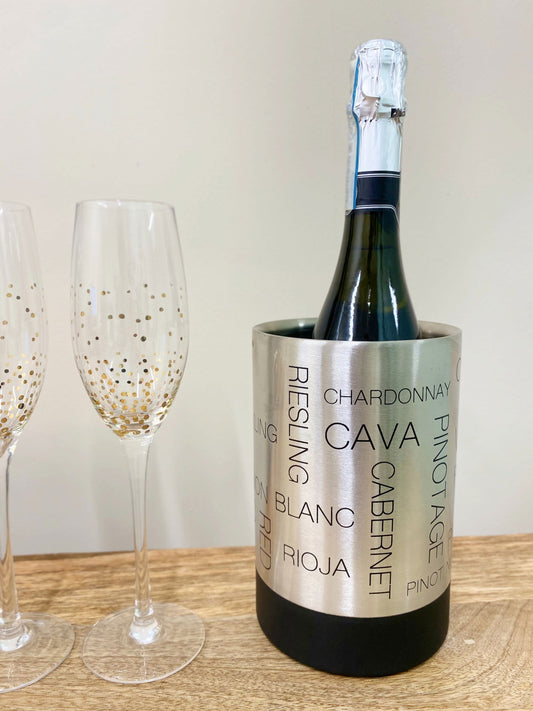 Stainless steel wine cooler displayed with a wine bottle and two wine glasses on a table, showcasing its sleek design and entertaining appeal.
