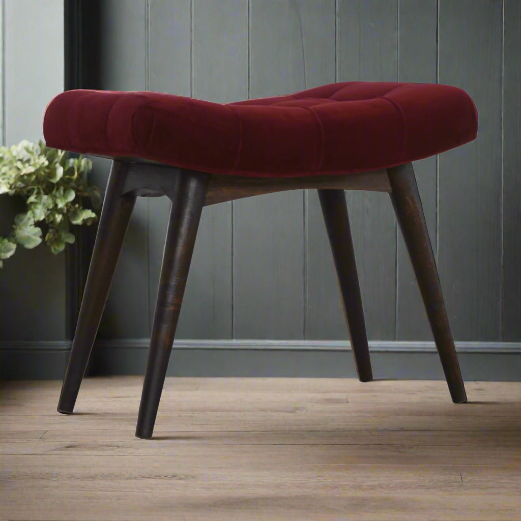Wine Red Velvet Curve Stool with walnut finish Nordic style legs, angled front view, showcasing its elegant design.

